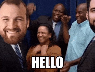 a group of people are posing for a picture and the word hello is on the bottom right