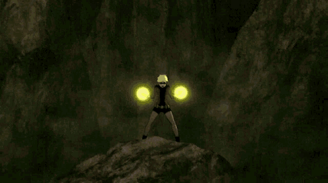 a person standing on a rock holding a yellow object