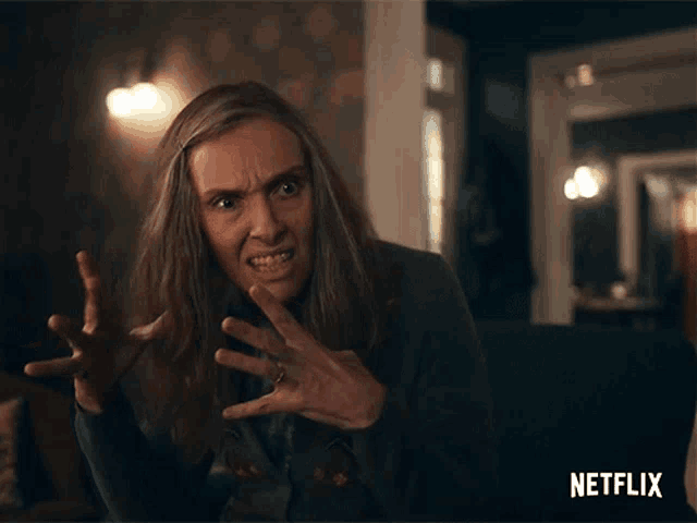 a woman is making a funny face with a netflix logo in the corner