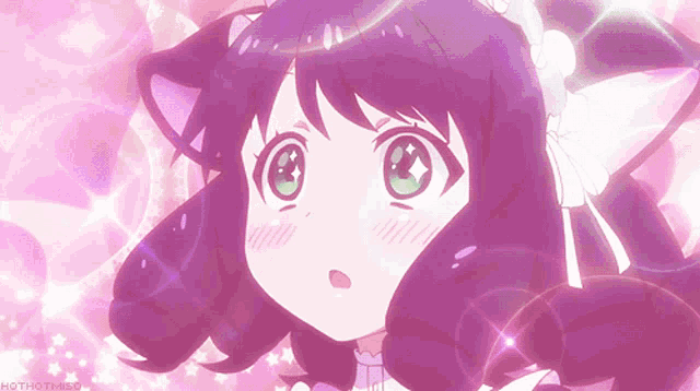 a girl with purple hair and green eyes is surrounded by pink sparkles