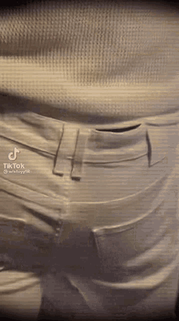 a close up of a person 's pants with a tik tok watermark on the bottom