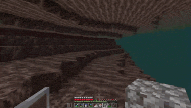 a person is playing a video game in a cave with a black square in the middle .