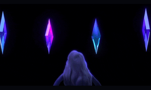 a little girl is standing in front of a row of crystals
