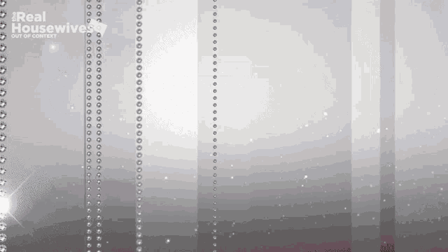a real housewives logo is on a gray background