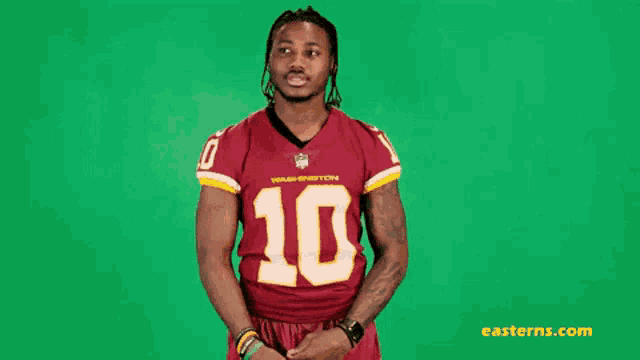 a man in a washington redskins jersey with the number 10 on it