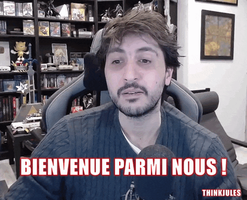a man sitting in a chair with the words bienvenue parmi nous written on the bottom