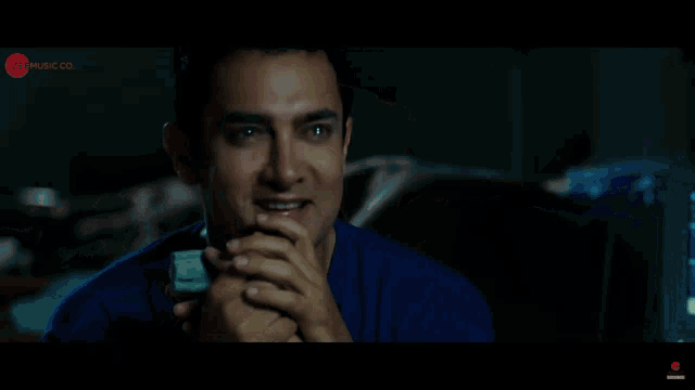 a man in a blue shirt is smiling in a youtube ad