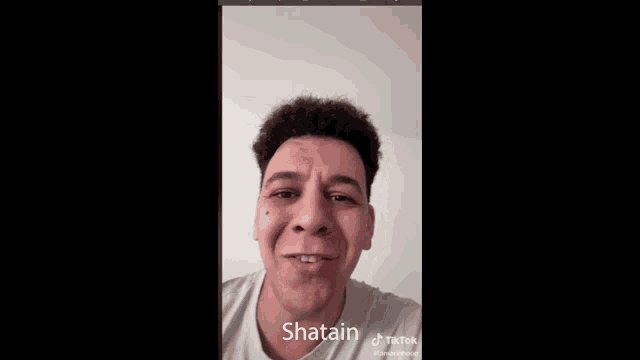 a man 's face is shown in a tiktok video with the name shatain at the bottom