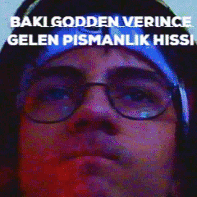 a man wearing glasses and a hat with the words baki godden verince gelen pismanlik hissi