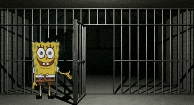 spongebob is smiling in a jail cell