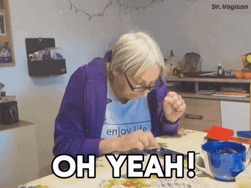 an elderly woman sitting at a table with the words oh yeah written on it