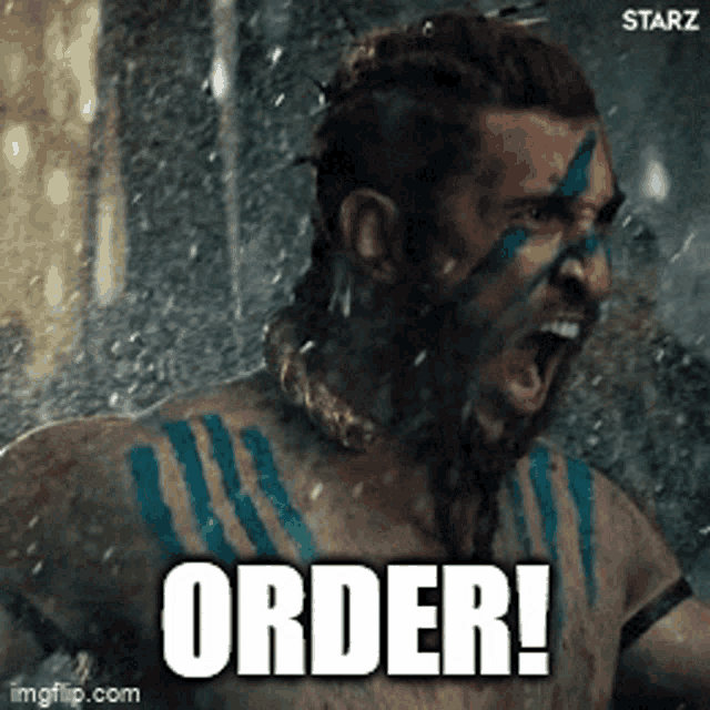 a man with a beard and blue paint on his face screams order