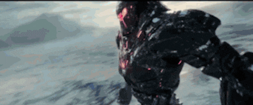 a close up of a robot standing in the snow in a video game .