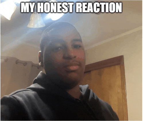 a man is taking a selfie with the caption my honest reaction