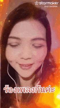 a woman wearing headphones is smiling with a starmaker logo in the corner