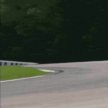 a race car is going around a curve on a road