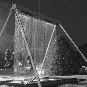 a black and white photo of a water curtain