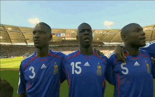 three soccer players wearing blue jerseys with the numbers 3 15 and 5 on them