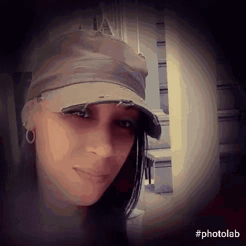 a woman wearing a hat with the hashtag photolab on the bottom