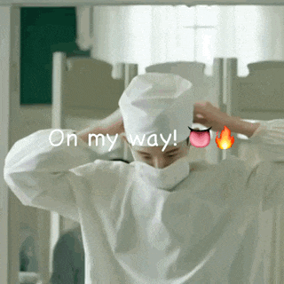 a man in a surgical gown with the words " on my way " written above him