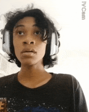 a young man wearing headphones and a t-shirt with the word ivoana on the bottom
