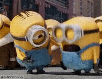 a group of minions wearing goggles and overalls are standing next to each other .