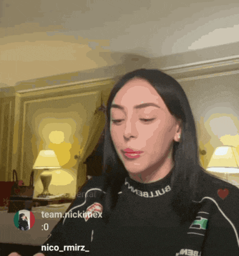 a woman wearing a black sweater that says nico_rmirz