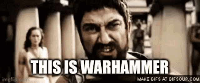a man with a beard is saying this is warhammer .