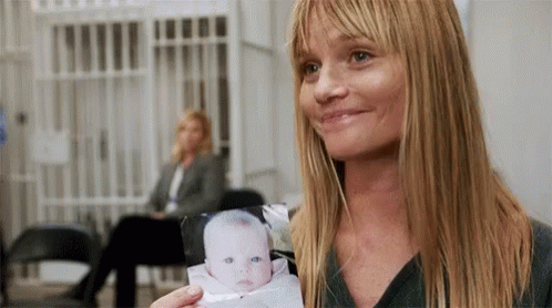 Smiling Baby Sitter GIF - Smiling Baby Sitter Looking Back GIFs