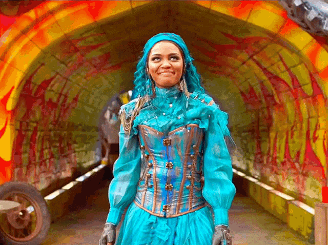 a woman with blue hair and a blue corset stands in a tunnel