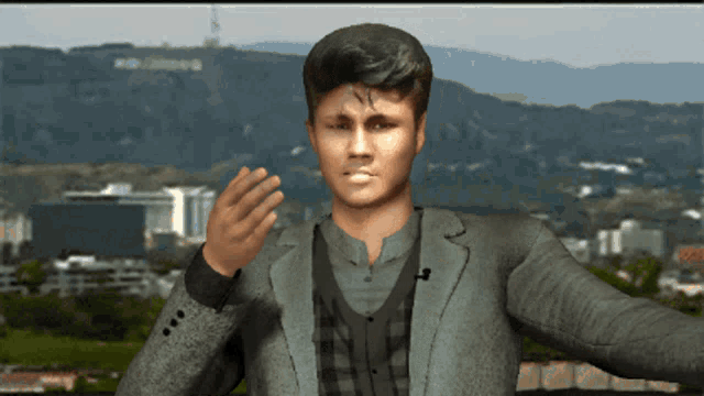 a man in a suit is waving in front of a mountain