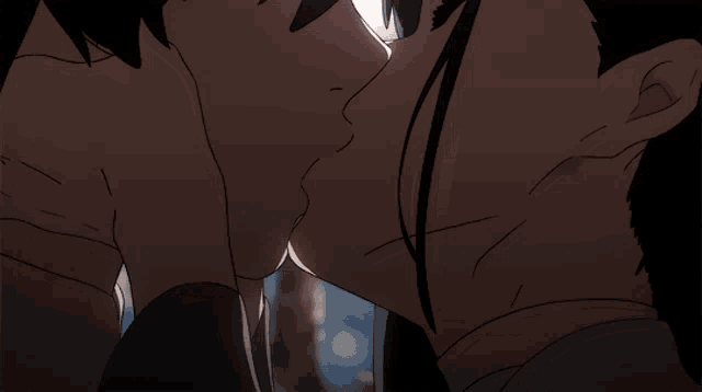 a man and a woman are kissing in a close up of their faces