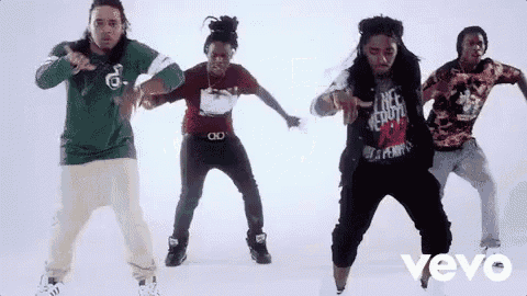 a group of young men are dancing in a video .