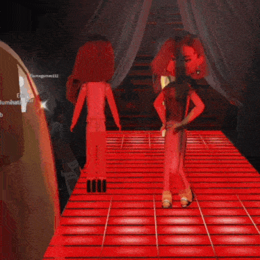 a doll in a red dress is standing on a red carpet