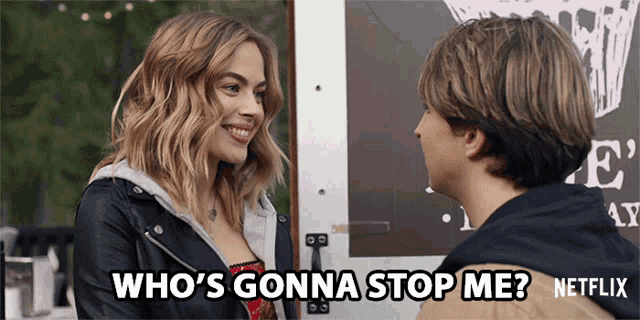 a man and a woman are standing next to each other and the woman says who 's gonna stop me netflix