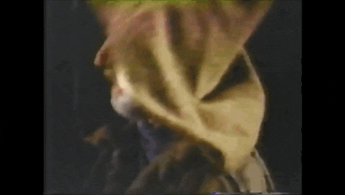 a close up of a person 's face with a hood on .