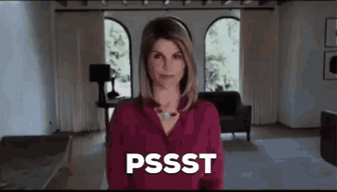 a woman in a red shirt is standing in a living room with the words pssst written on her face .