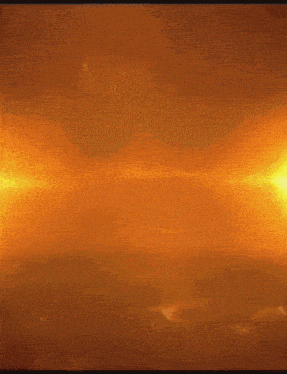 a blurred image of a fire with a few sparks coming out of it
