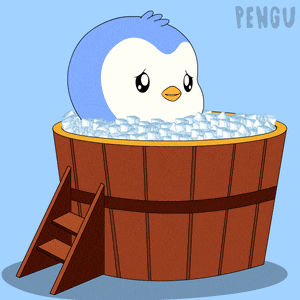 a penguin is sitting in a bucket of ice