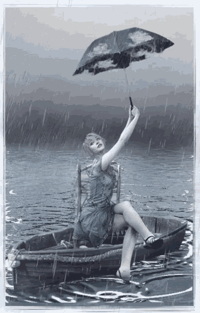 a woman sits in a boat holding an umbrella in the rain