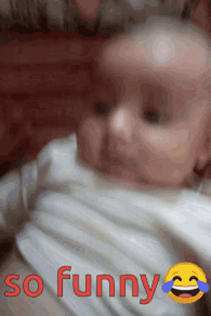 a baby with a smiley face and the words so funny below it