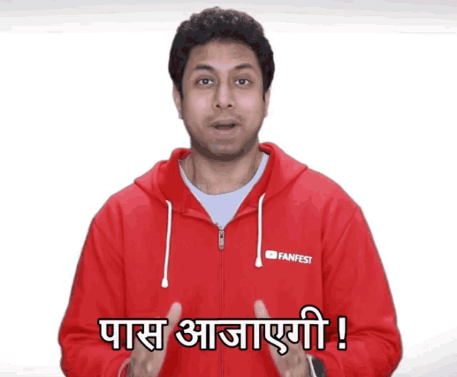 a man wearing a red fanfest hoodie says pass