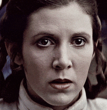 a close up of a woman 's face with a serious expression