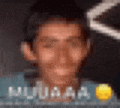 a blurry picture of a man 's face with the words muaaa written on it