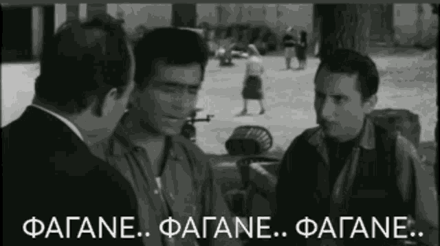 a black and white photo of three men with the words fagane fagane fagane in white letters