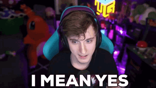 a man wearing headphones says i mean yes in front of a purple background