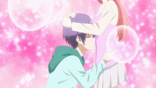 a boy is kissing a pregnant girl 's belly in a pink background