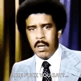 a man in a suit and tie is making a funny face and saying `` the fuck you say '' .