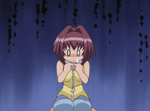 a girl in a yellow tank top is kneeling down with her hands on her chest