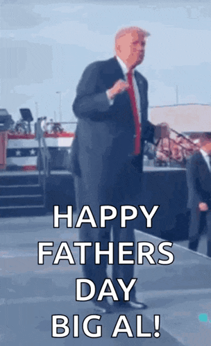 a man in a suit and tie is standing on a stage and says happy father 's day big al